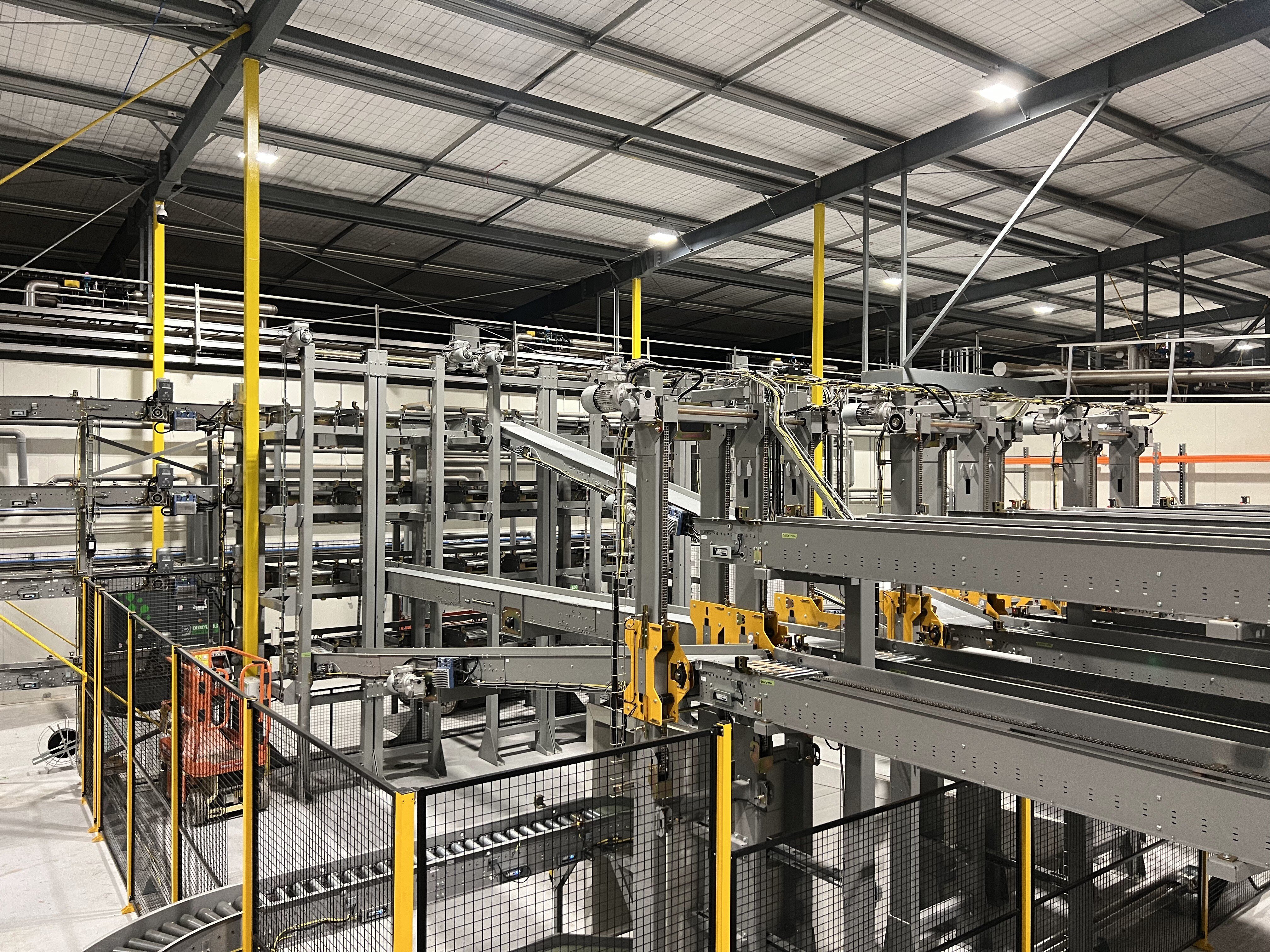 automated conveyor system used for warehouse automation within a large warehouse or factory
